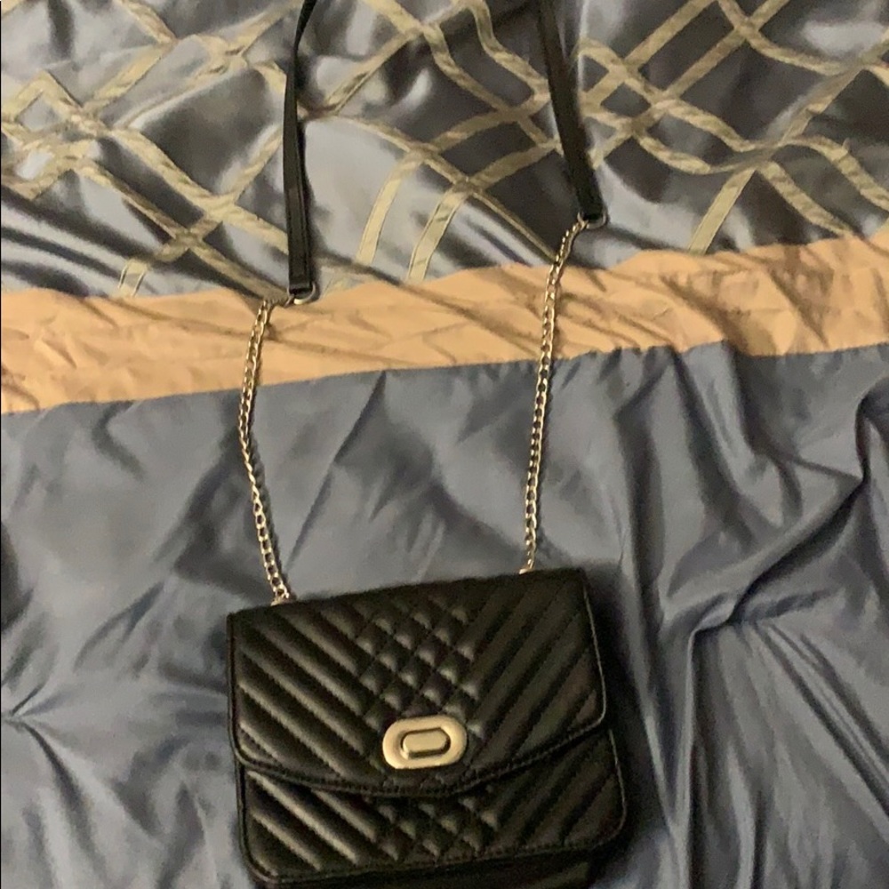 Black purse with silver chain straps